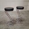 Sleek chrome and leather bar stools.