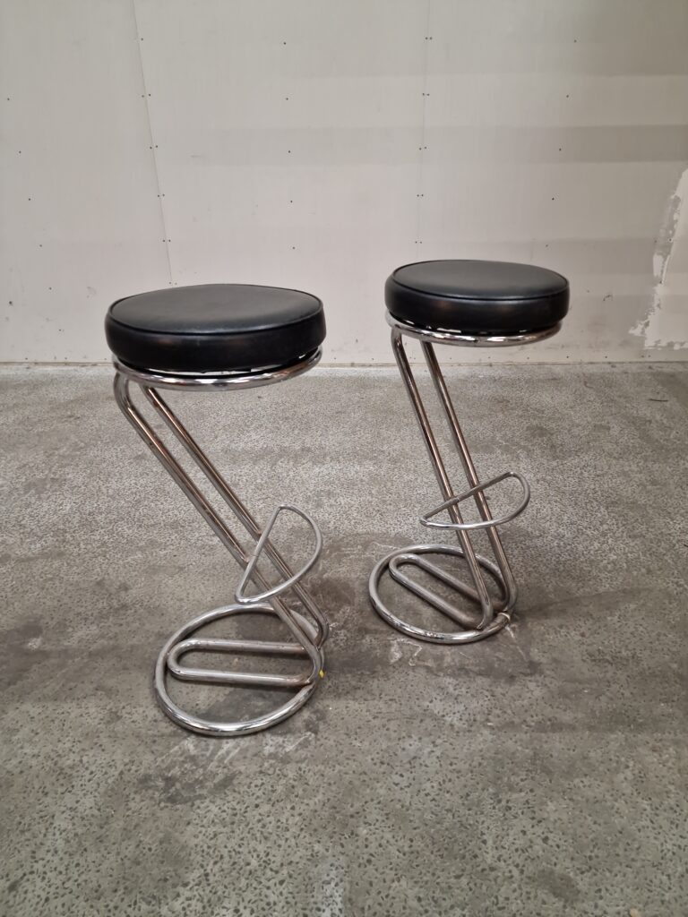 Sleek chrome and leather bar stools.