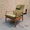 Mid-century modern olive green armchair.